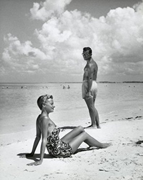 Posterazzi Side Profile Woman Sitting with Young Man Standing on Beach Poster Print (18 x 24) Posterazzi Side Profile Woman Sitting with Young Man Standing on Beach Poster Print (18 x 24)