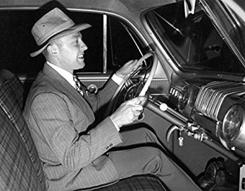 Posterazzi Side view of mature man sitting inside of car Poster Print (18 x 24)