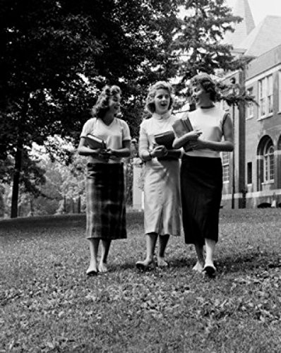 Three female students walking in front of university building and talking Poster Print (18 x 24)