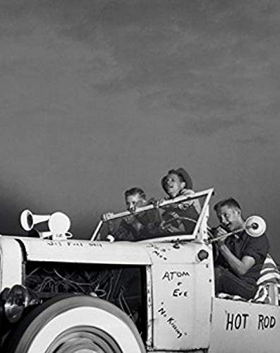 Low angle view of three teenage boys sitting in a vintage car Poster Print (18 x 24)