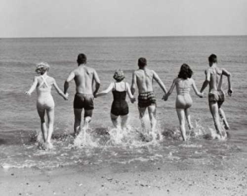 Rear view of three young couples running on the beach Poster Print (18 x 24)