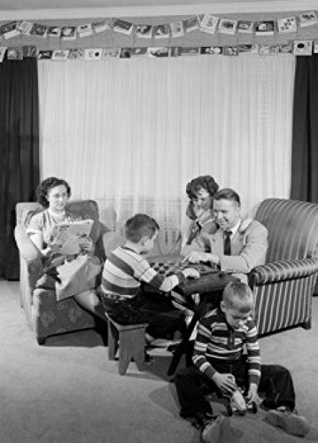 Posterazzi Family with three children in living room Poster Print, (18 x 24)