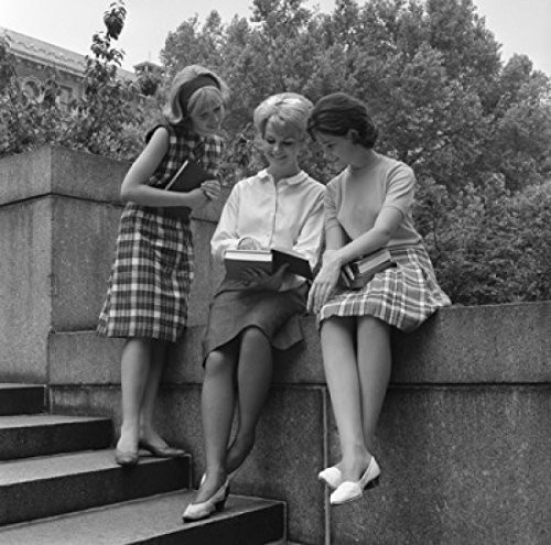 Posterazzi Three young students checking something in book and smiling Poster Print, (18 x 24)