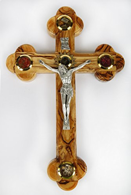 Olive Wood Crucifix / Wall Cross adorned with olive leaves, frankincense, flowers and stones from Jerusalem Hand Crafted by Artisans in Bethlehem (the heart of the holy land). An Ideal Religious Gift for Christmas or any other Christian Holiday. Comes with a certificate of authenticity to explain the collection inside the four corners of the cross (stones)