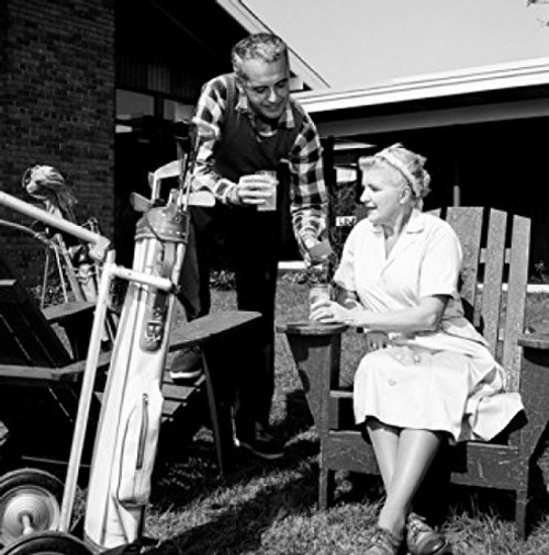 Posterazzi Mid adult man and mother having break from playing golf Poster Print  18 x 24