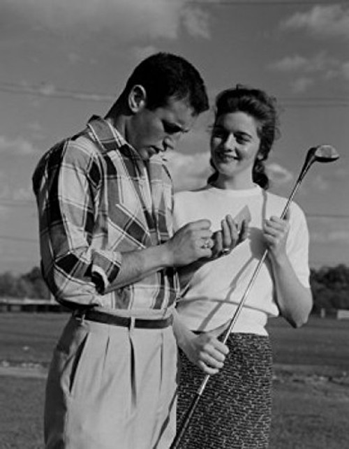 Young couple woman holding golf club Poster Print  18 x 24