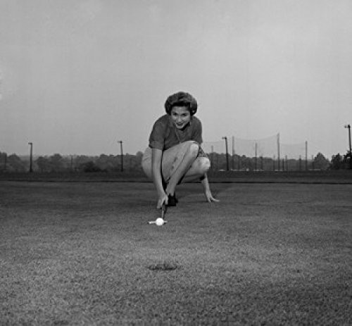 Posterazzi Mid adult woman playing golf course Poster Print  18 x 24