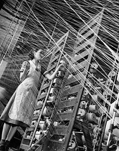 Posterazzi Low angle view of a woman working in a textile factory Poster Print 18 x 24