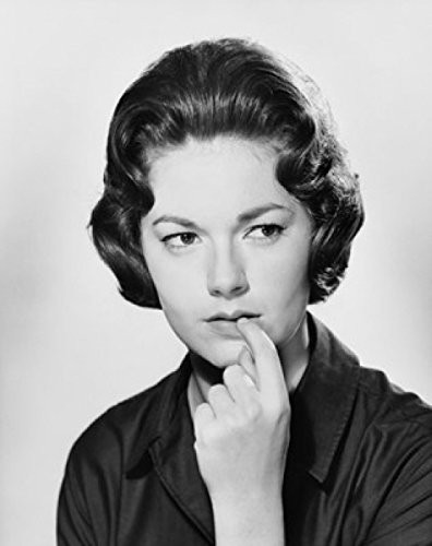 Posterazzi Closeup of a young woman with her finger in her mouth Poster Print 18 x 24