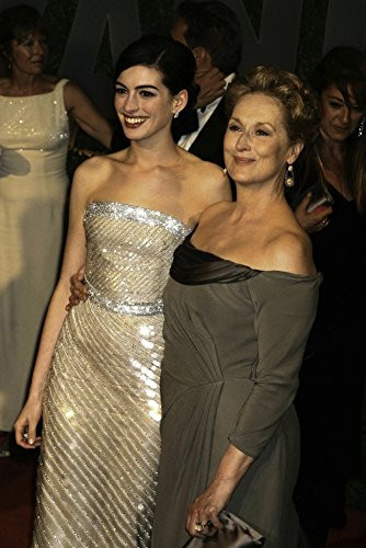 Anne Hathaway and Meryl Streep arriving at the Vanity Fair Oscar Party at Sunset Towers in Los Angeles Photo Print 8 x 10