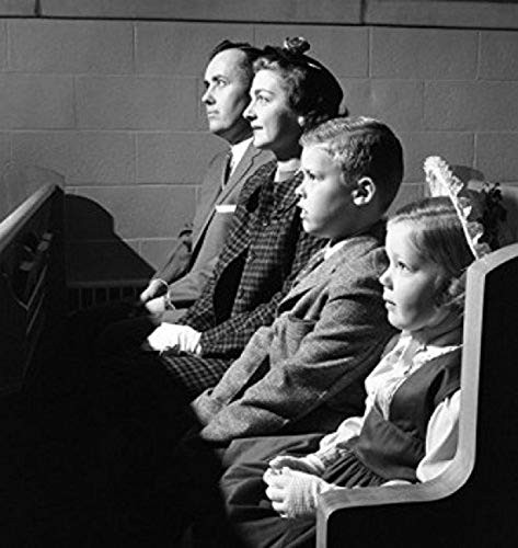 Family sitting in church Poster Print 18 x 24