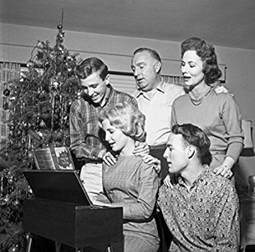 Posterazzi Family playing and singing Christmas carols Poster Print 18 x 24 Posterazzi Family playing and singing Christmas carols Poster Print 18 x 24