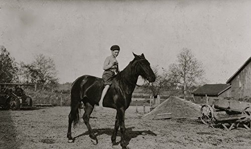 Riding a horse on the family farm Poster Print 18 x 24