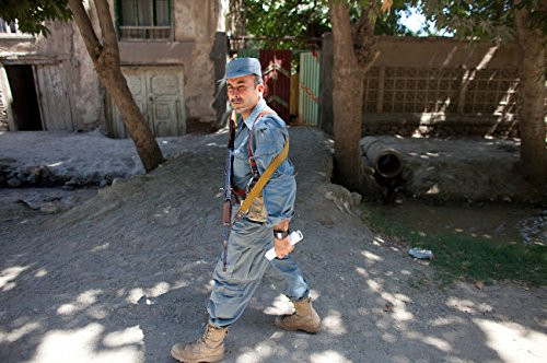 Afghan National Police officer on foot patrol in Khan Abad Kunduz Afghanistan Poster Print by VWPicsStocktrek Images  17 x 11