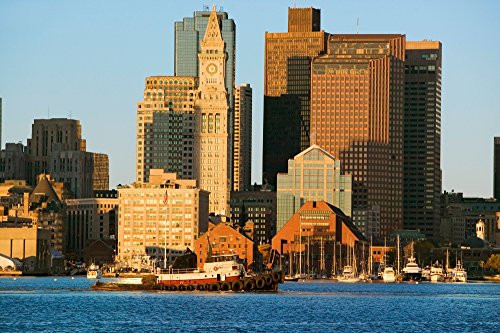 Tugboat with Boston Harbor and the Boston skyline at sunrise as seen from South Boston Massachusetts New England Poster Print by Panoramic Images (24 x 18)