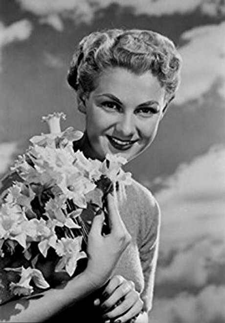 Posterazzi Portrait of young woman holding bunch of daffodils Poster Print 18 x 24 Posterazzi Portrait of young woman holding bunch of daffodils Poster Print 18 x 24