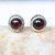 Round cabochon garnet earrings in silver bezel setting with sterling silver post and backing