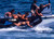 Navy SEALs practice high speed boat cast and recovery Poster Print by Michael WoodStocktrek Images -17 x 11-