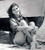 Posterazzi DAP15401 Claudia Cardinale - Sitting in Front of Boat Photo Print  8 x 10  Multi