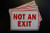(10 Pack) Not an Exit Sign - 7" X 5" Vinyl Stickers Decals - Waterproof, Indoor or Outdoor Use Self Adhesive (X10PS40)