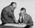 Posterazzi Side Profile Explaining documents to Another Businessman Poster Print (18 x 24)
