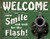 Desperate Enterprises Welcome Smile for The Flash Tin Sign 16  W x 125  H