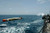 A recoverable MK 46 Exercise Torpedo is launched from the Guided Missile Destroyer USS Donald Cook Poster Print by Stocktrek Images  17 x 11