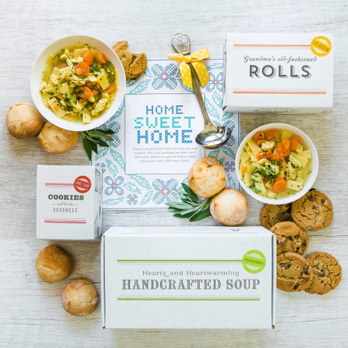 Housewarming Package: Two bowls of chicken noodle soup surrounded by rolls and cookies. Ladle and insert in image Insert reads: Home Sweet Home