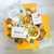 Housewarming Package: Two bowls of chicken noodle soup surrounded by rolls and cookies. Ladle and insert in image Insert reads: Home Sweet Home Housewarming Package: Two bowls of chicken noodle soup surrounded by rolls and cookies. Ladle and insert in image Insert reads: Home Sweet Home