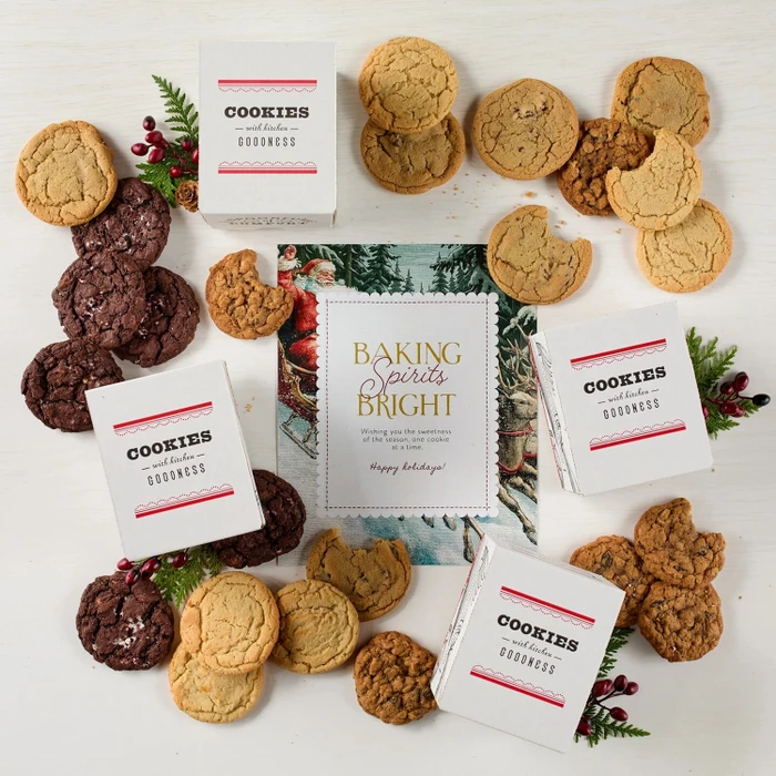 Festive Holiday Cookie Package with a decorative insert, and surrounded by cookie boxes.