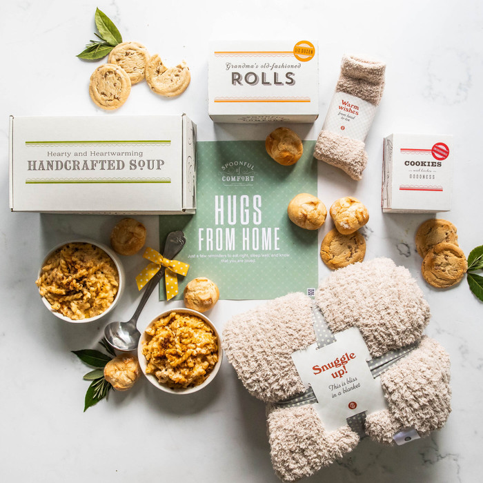 Ultimate College Student Care Package with soup, rolls, cookies, a Cozy Comfort Throw, Cozy Comfort Socks and a package insert with text Hugs From Home