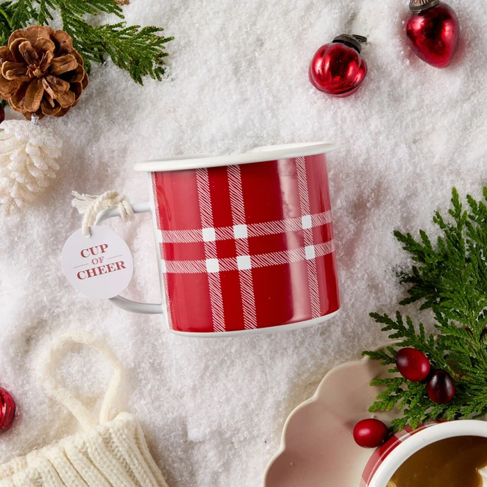 Festive Holiday mug surrounded by holiday decorations