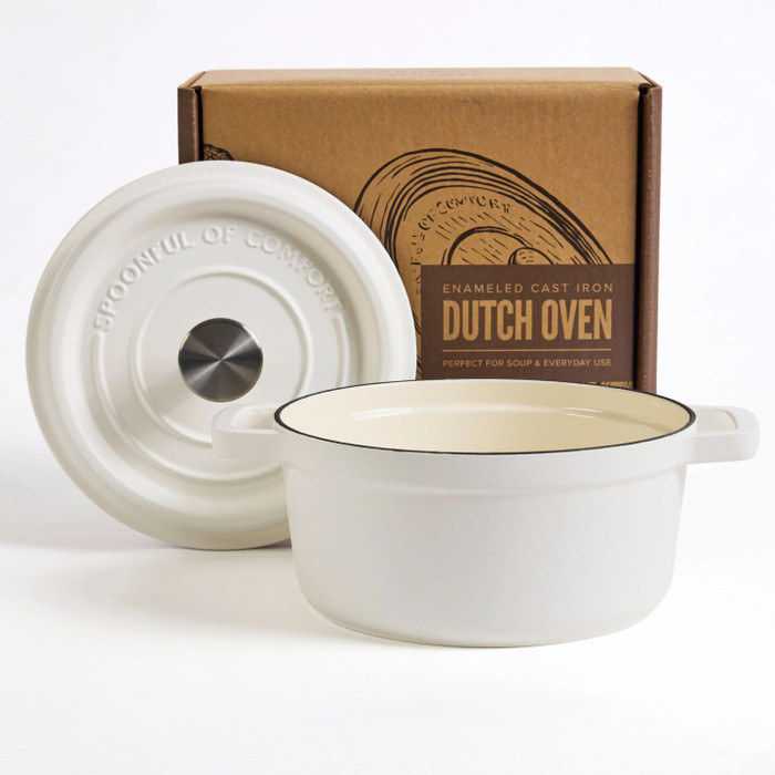 White enameled cast iron Dutch oven with lid displayed in front of its packaging box labeled “Dutch Oven.”