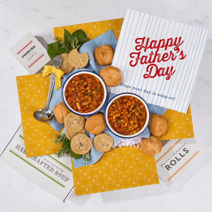 Overhead image of a Father’s Day promotional card beside packaged soup, bread rolls, and baked treats.