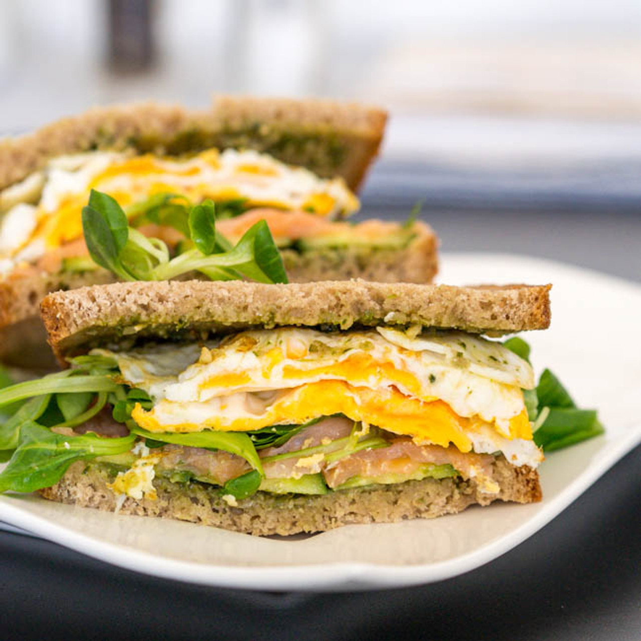 BREAKFAST SANDWICH WITH FRIED EGGS AND SMOKED SALMON