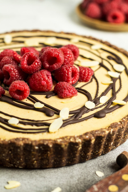 Chocolate Peanut Butter Fudge Tart with Raspberry Filling and White Chocolate Topping