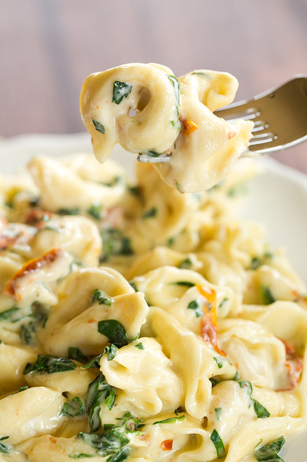 Tortellini with Spinach and Sun-Dried Tomatoes in a Garlic-Parmesan Cream Sauce