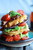 Avocado and Gouda BLT Corn Fritter Stacks with Chipotle Bourbon Dressing
