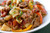 Saucy, Italian “Drunken” Noodles w/ Spicy Italian Sausage, Tomatoes, Caramelized Onions, Peppers - 2 lbs