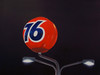 Ventura Blvd (2026) by Eric Nash is a photorealist oil painting featuring an iconic illuminated 76 gas station sign, capturing the atmosphere and visual culture of Southern California at night, a photorealistic oil painting of a glowing orange 76 gas station sign illuminated against a dark nighttime sky.