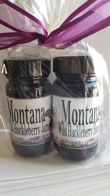 Two three ounce jars of huckleberry jam and honey