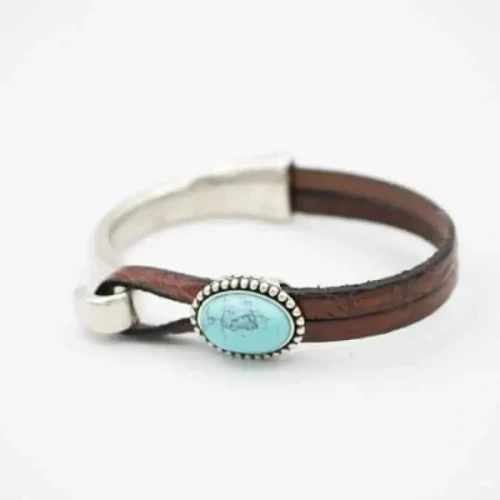 Turquoise gemstone with embossed leather and silver plating made in Montana USA.