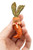 Bunny-carrot pin held in hand. The bunny has an long teeth.