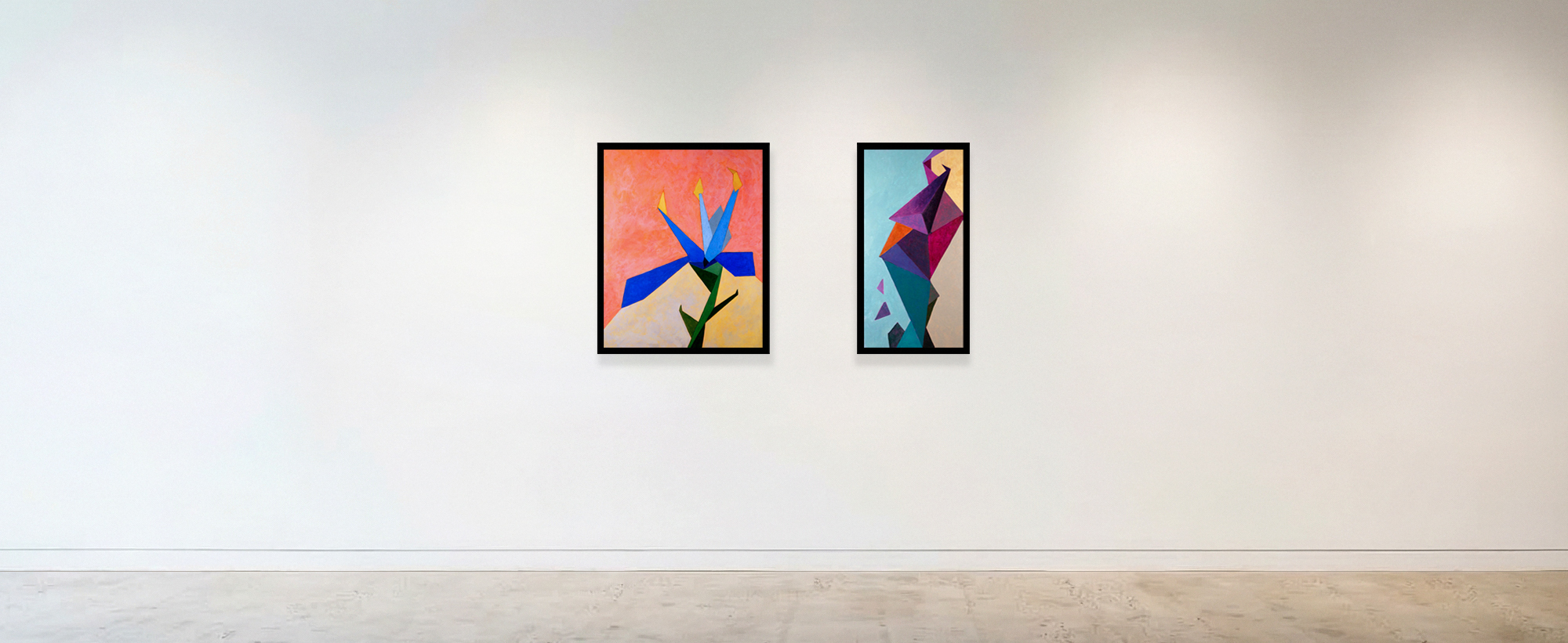 Photo of two geometric abstract paintings on a white wall in a gallery.