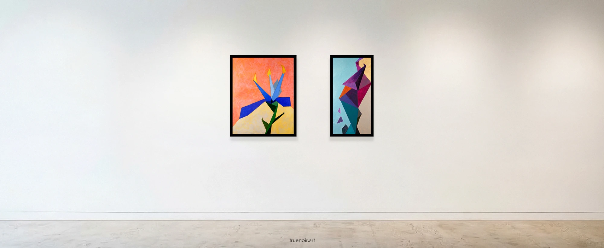 Photo of two geometric abstract paintings on a white wall in a gallery.