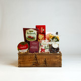This beautiful wooden box with fired evergreen design is packed full of delectable holiday favourites!  Melt in your mouth Baru chocolate covered marshmallows from Belgium, a mini Italian Panettone, and Cartwright and Butler tea for the tea lover on your list to name just a few of the fantastic items found in this basket. 