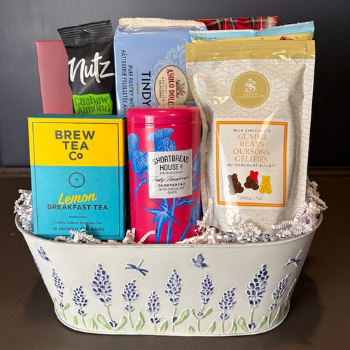 A beautiful lavender motif metal container filled with everything needed to relax and indulge! Cookies, lemon filled pastry puffs, Nutz Cashew & Almond mix, popcorn, chocolate, Brew Co Lemon Tea, and more! Sure to please with something for everyone in this exquisite selection! Order yours today! 