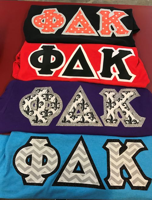 Phi Delta Kappa Greek letter shirts. Black twill on white twill on a red shirt.