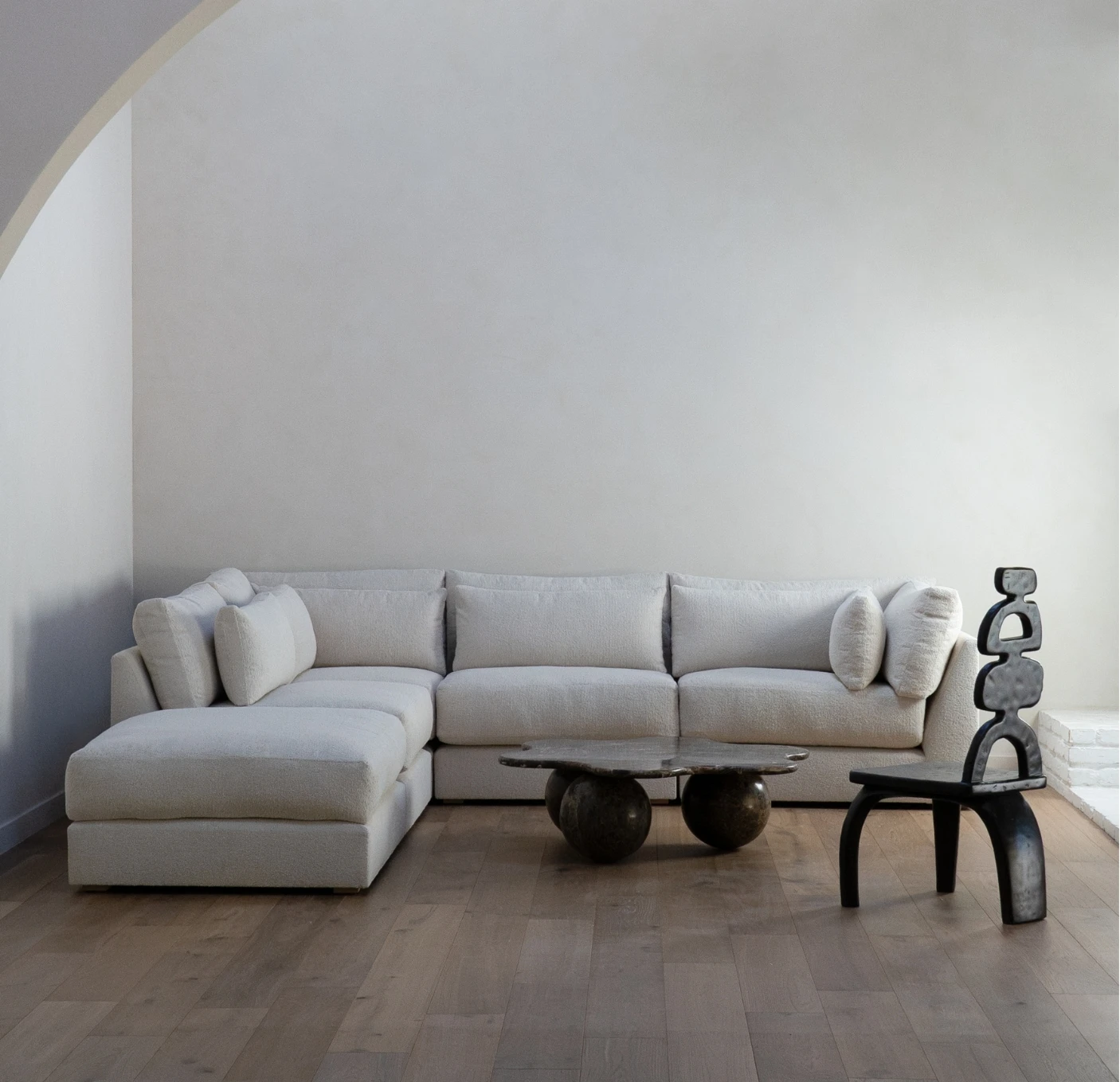 Basics by Moss Home sectional in a light living room