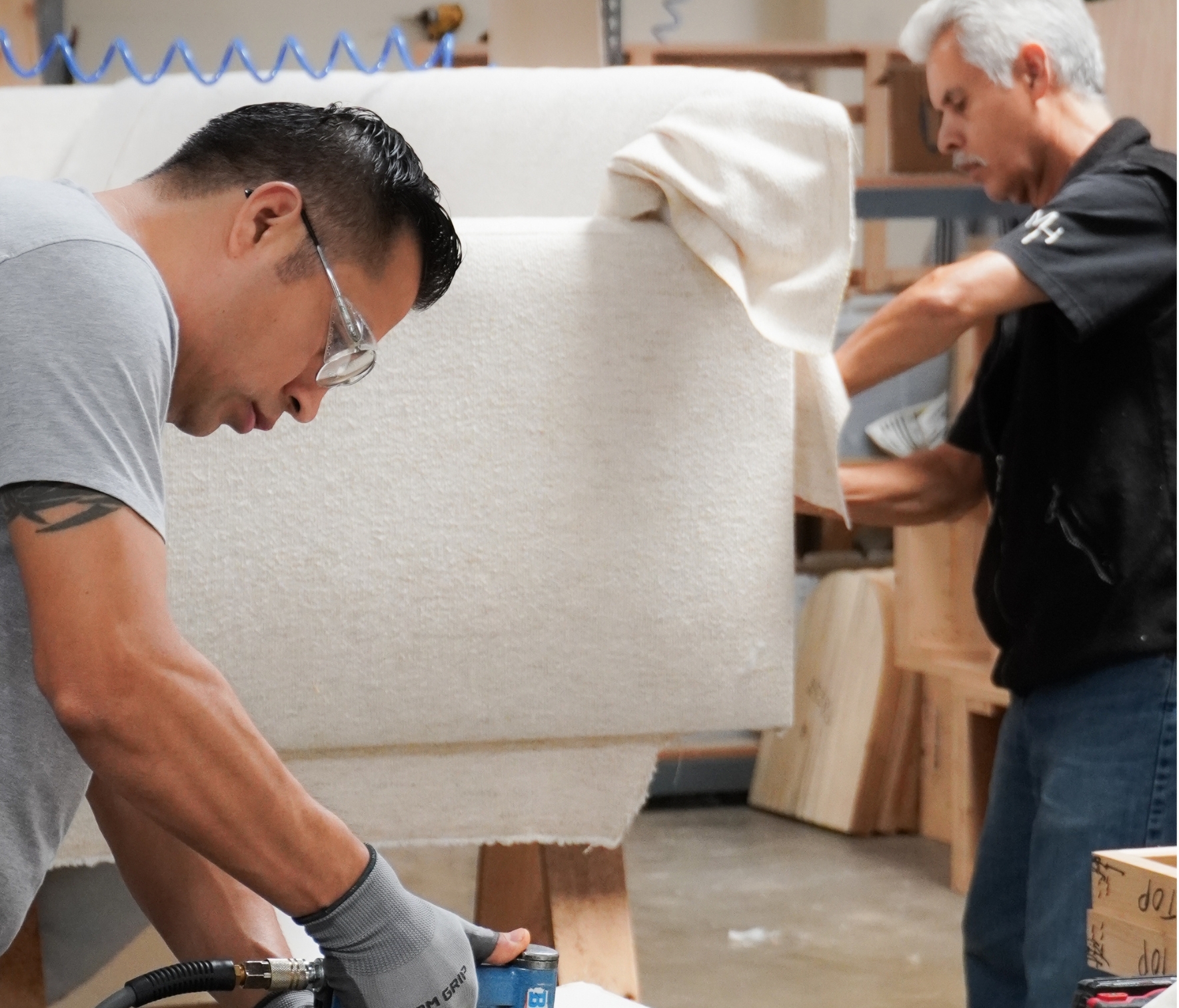 Men working on sofa
